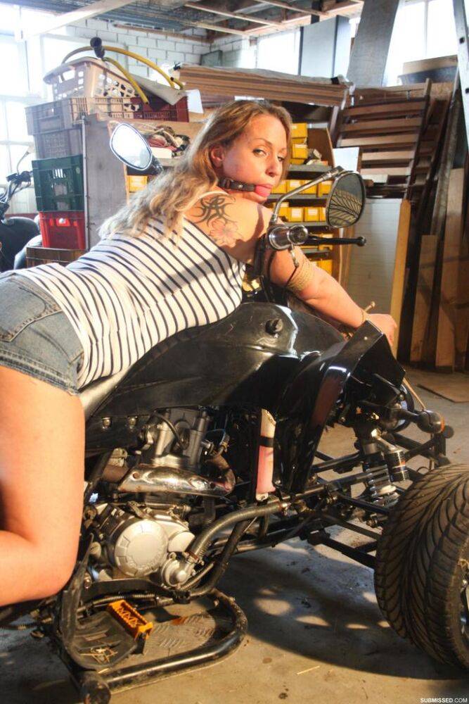 Blonde female DD is left ball gagged and rope bound atop a 3 wheeler - #13