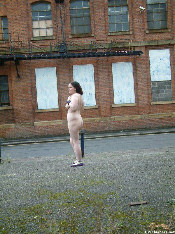 Plump girl goes for a naked walk in parking lot in industrial area - #12