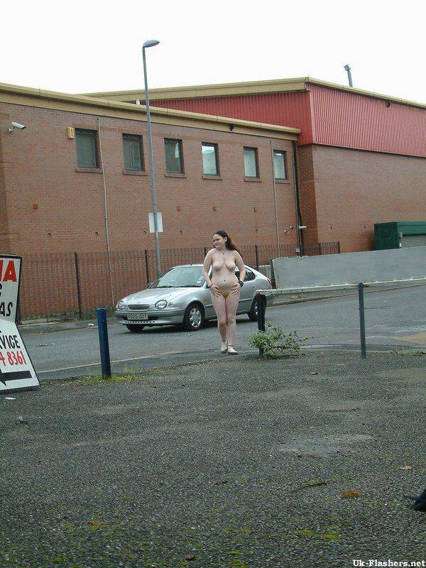 Plump girl goes for a naked walk in parking lot in industrial area - #7