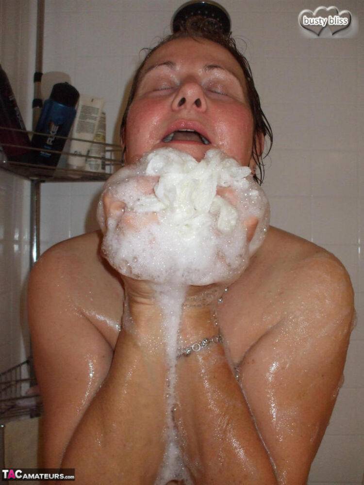 Naked older woman Busty Bliss washes her big boobs while taking a shower - #15