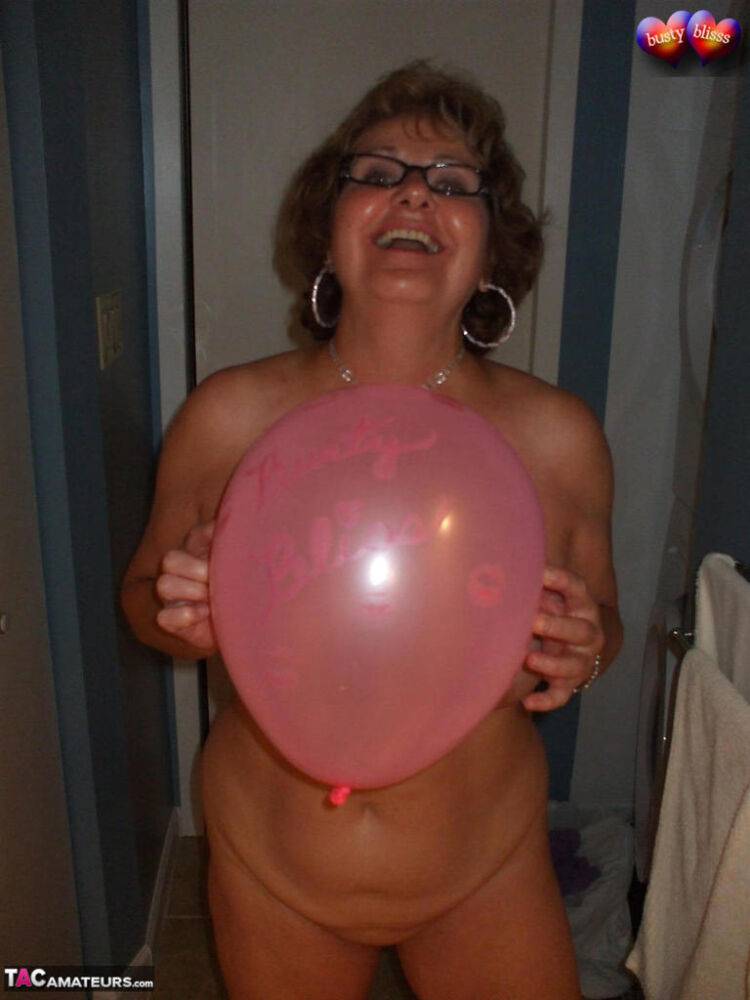 Naked mature woman Busty Bliss gets into a bathtub filled with balloons - #15