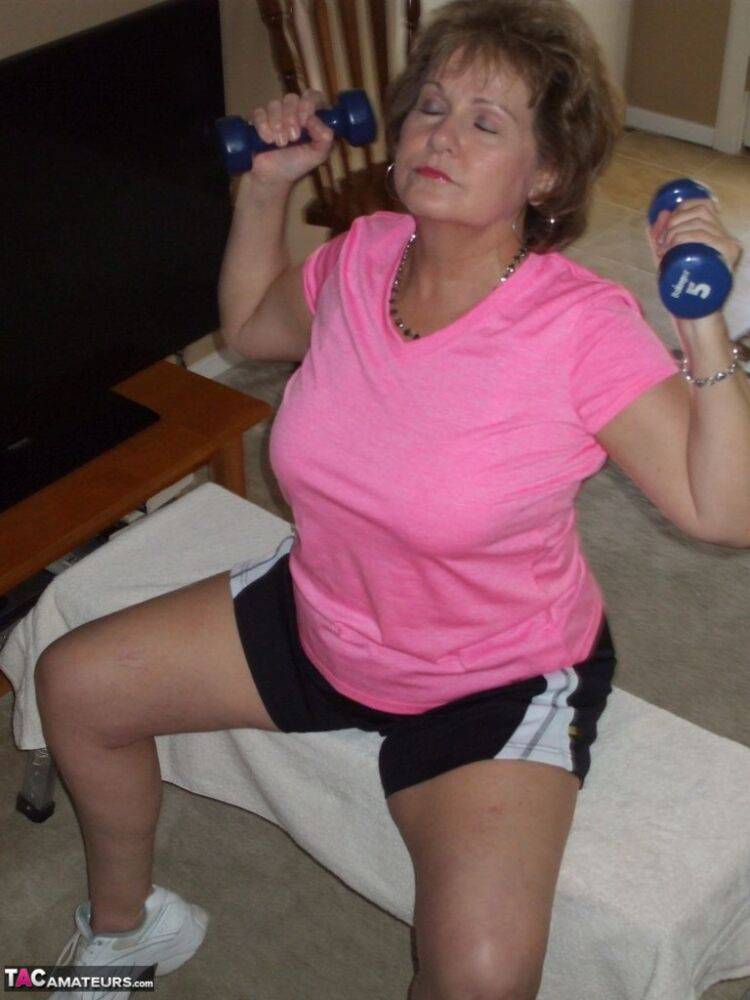 Mature woman Busty Bliss exposes her natural boobs while working out at home - #2
