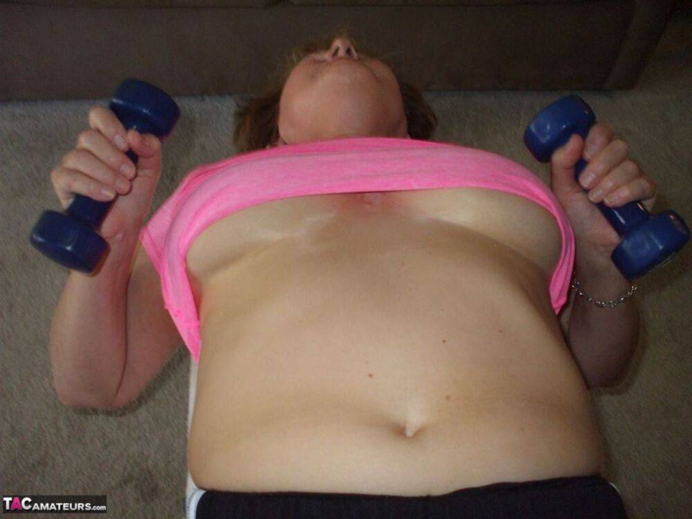 Mature woman Busty Bliss exposes her natural boobs while working out at home - #15