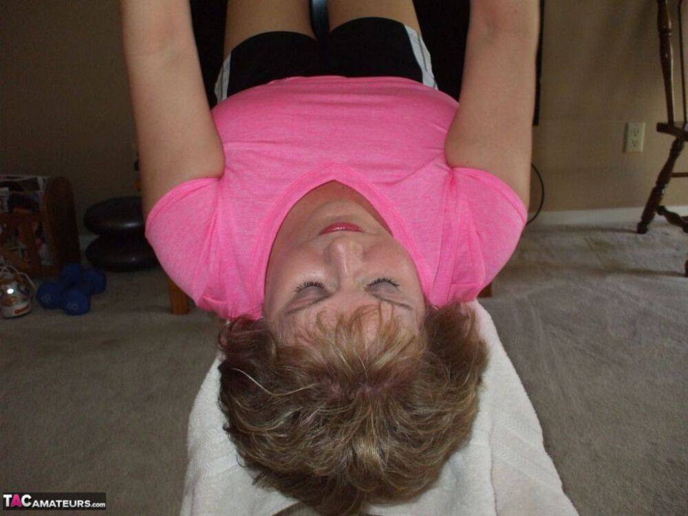 Mature woman Busty Bliss exposes her natural boobs while working out at home - #1