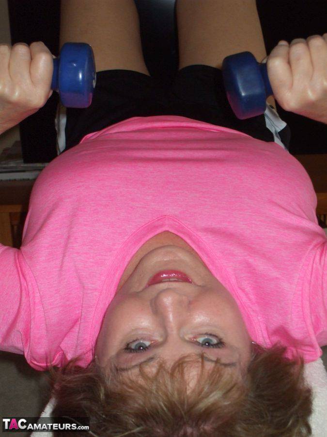 Mature woman Busty Bliss exposes her natural boobs while working out at home - #9