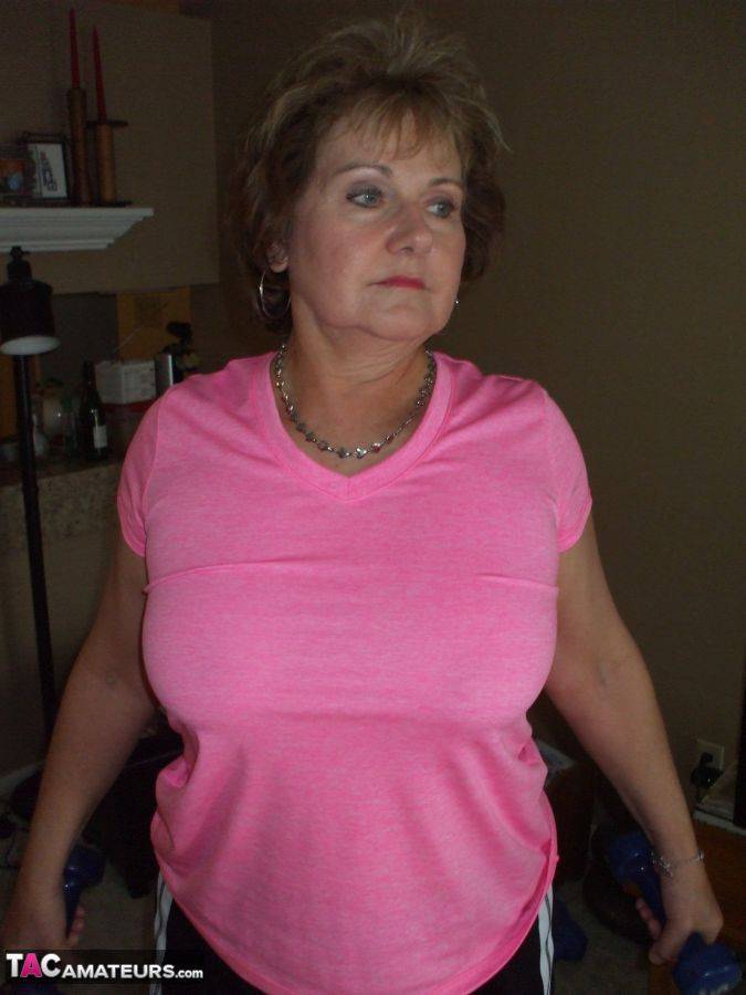 Mature woman Busty Bliss exposes her natural boobs while working out at home - #14