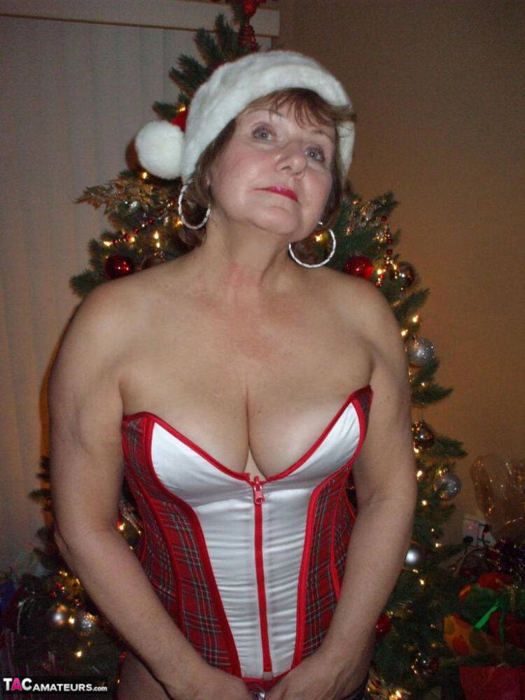 Mature amateur Busty Bliss displays her thong covered ass at Christmas - #2