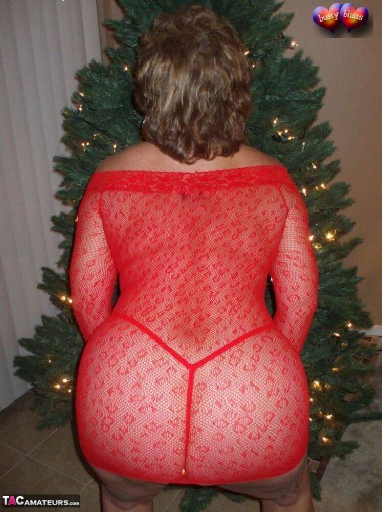 Mature lady Busty Bliss exposes her breasts during a Christmas celebration - #1