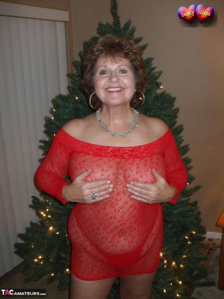 Mature lady Busty Bliss exposes her breasts during a Christmas celebration - #16