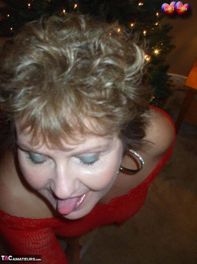 Mature lady Busty Bliss exposes her breasts during a Christmas celebration - #14