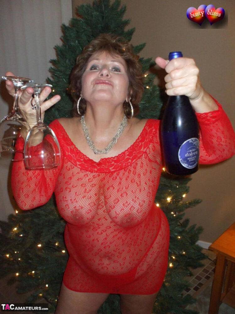 Mature lady Busty Bliss exposes her breasts during a Christmas celebration - #8