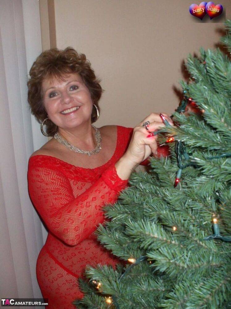 Mature lady Busty Bliss exposes her breasts during a Christmas celebration - #5
