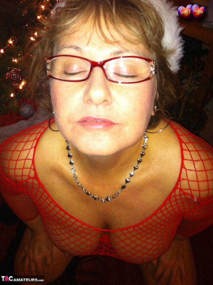 Middle-aged amateur Busty Bliss gives a BJ at Xmas in a mesh top and thong - #6