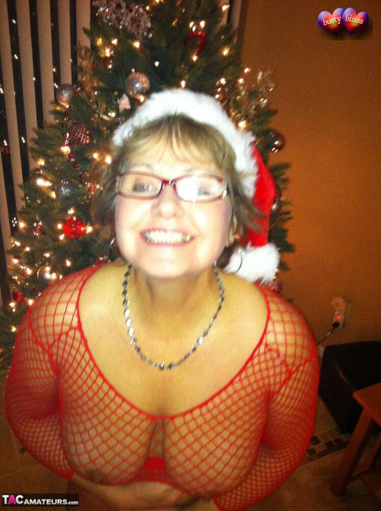 Middle-aged amateur Busty Bliss gives a BJ at Xmas in a mesh top and thong - #9