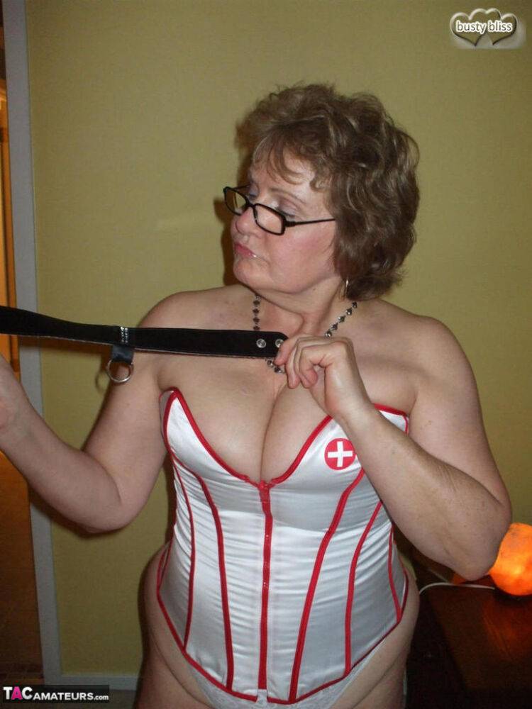 Older amateur Busty Bliss partakes in POV play while wearing a nurse's corset - #3