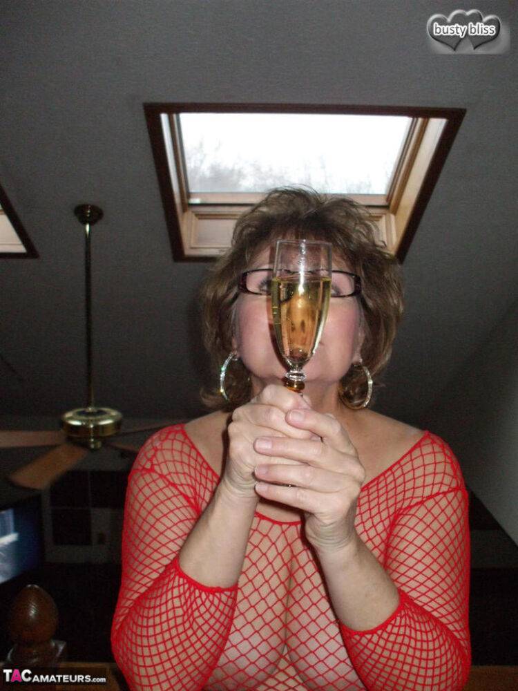 Older woman Busty Bliss enjoys a flute of wine during POV oral sex - #14