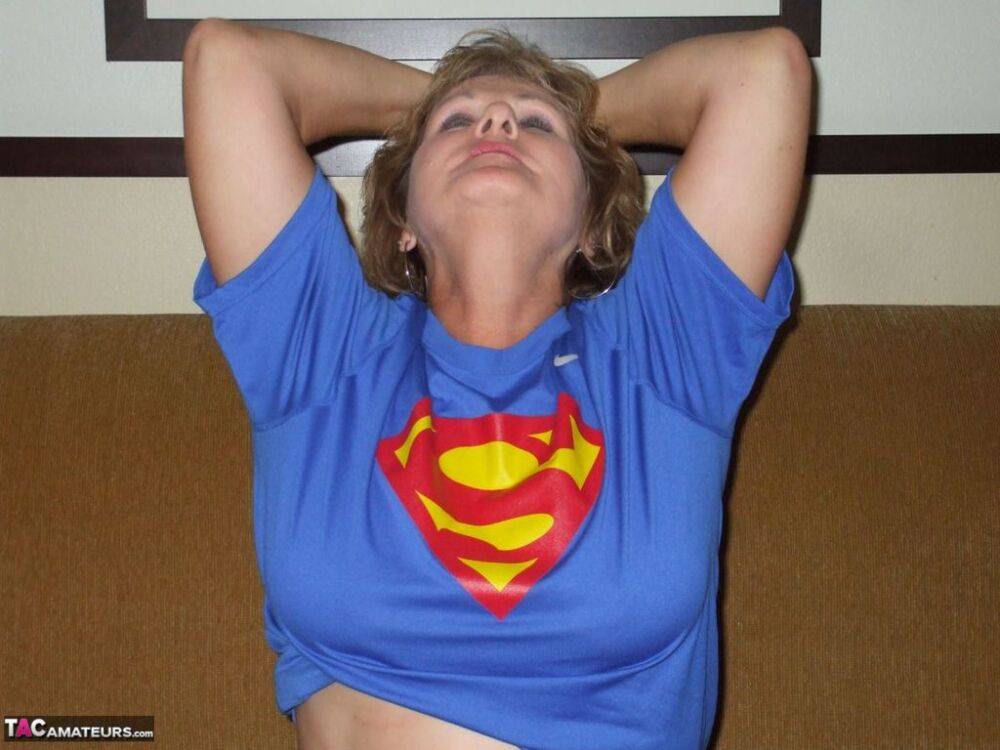 Older amateur Busty Bliss looses her big tits from a Superman T-shirt - #5