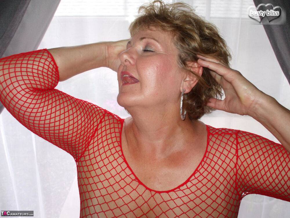 Mature lady Busty Bliss displays her big natural tits in a mesh dress - #11