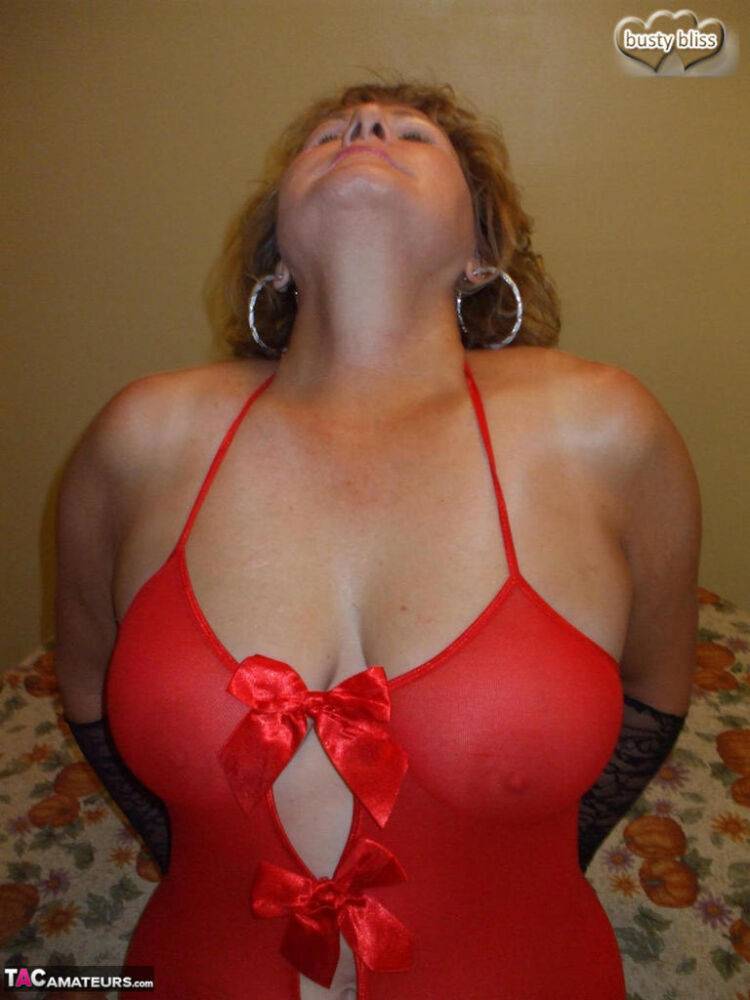 Aged amateur Busty Bliss slurps on a cold beverage while modeling red lingerie - #8