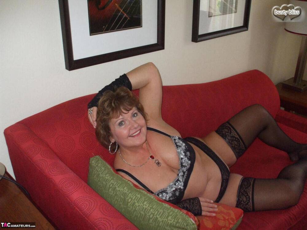 Mature lady Busty Bliss displays her natural tits in arm socks and stockings - #6