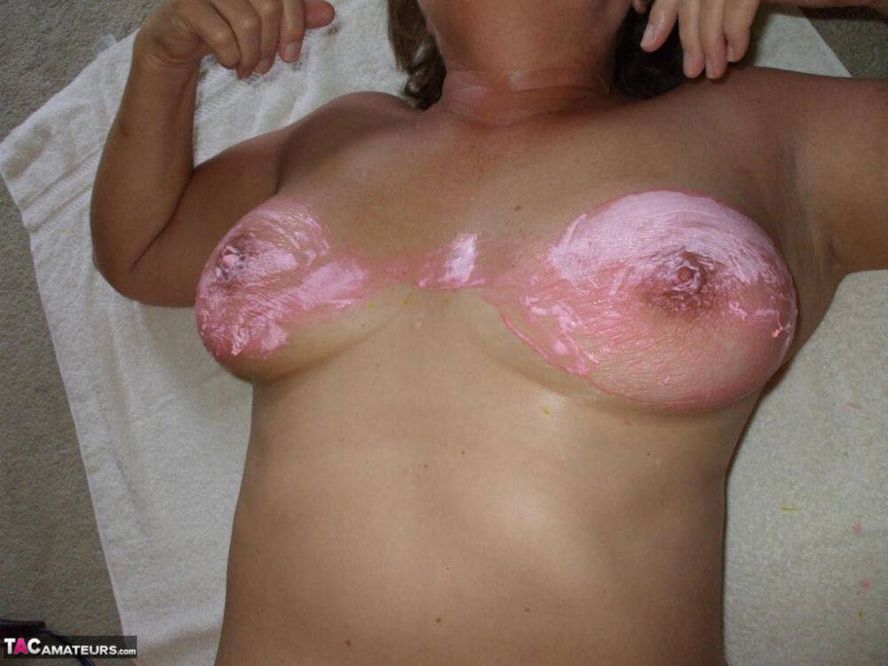 Naked older woman Busty Bliss covers her big naturals in latex body paint - #5