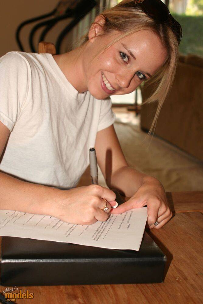 Young blonde stands naked before signing nude model release forms - #5