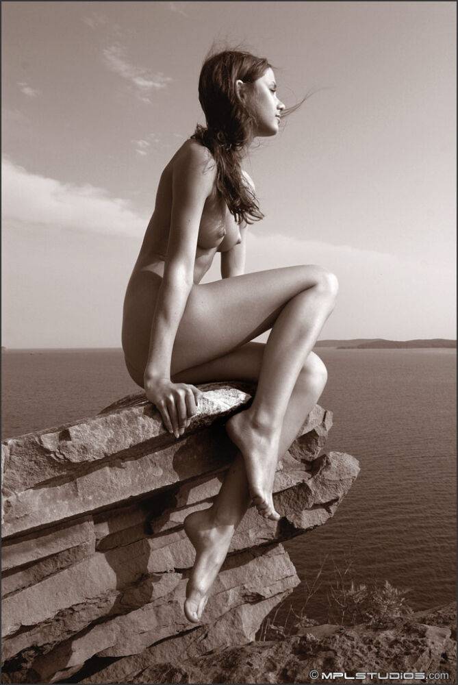 Leggy solo girl models naked on top of rocky oceanside outcrop - #5