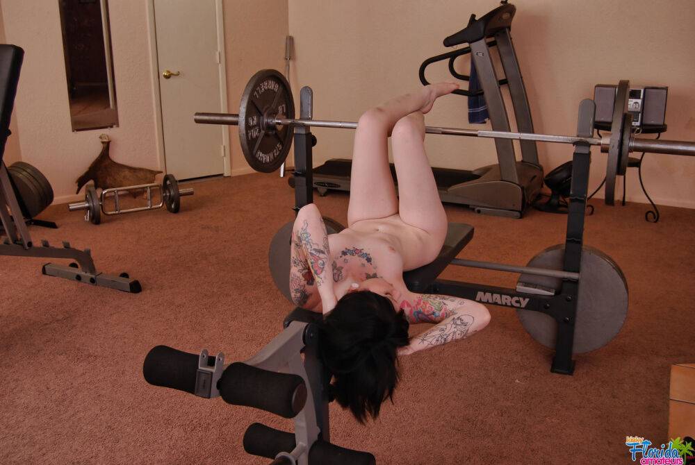 Tattooed brunette Barbie A models naked on workout equipment - #4