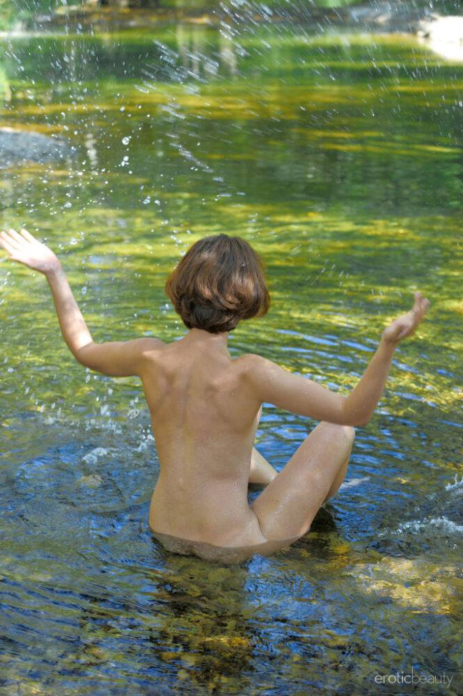 Solo girl with small tots and a trimmed twat models naked in shallow stream - #5