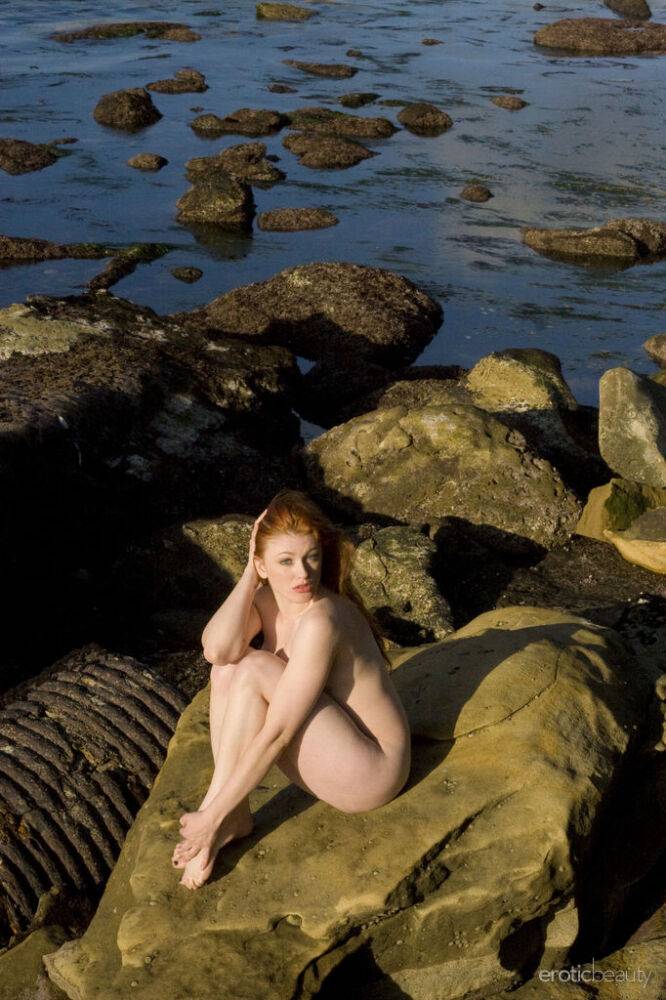 Pale redhead Ginger R models totally naked on seaside rocks - #12