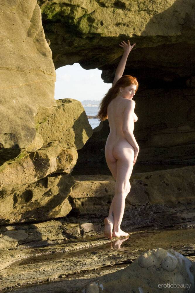 Pale redhead Ginger R models totally naked on seaside rocks - #6