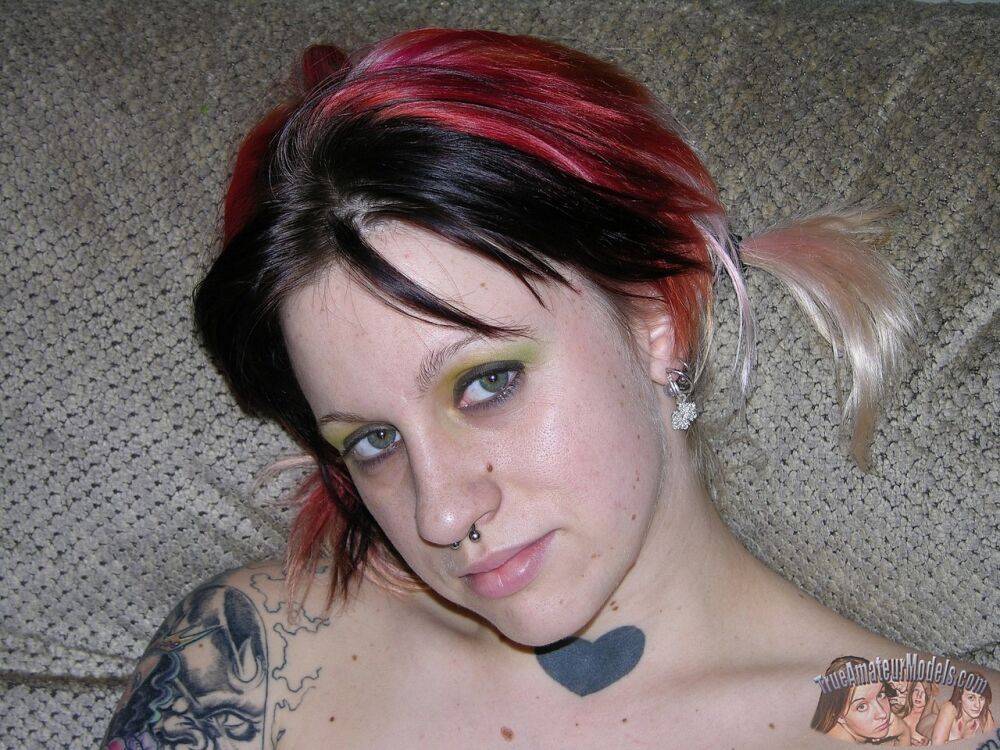 Tattooed chick with dyed hair gets naked on a couch during close up action - #7