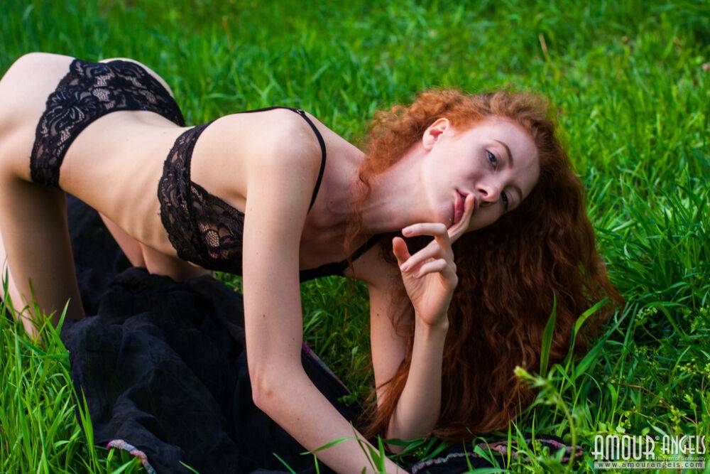 Thin redhead Veronika models totally naked on a blanket in a lush meadow - #16