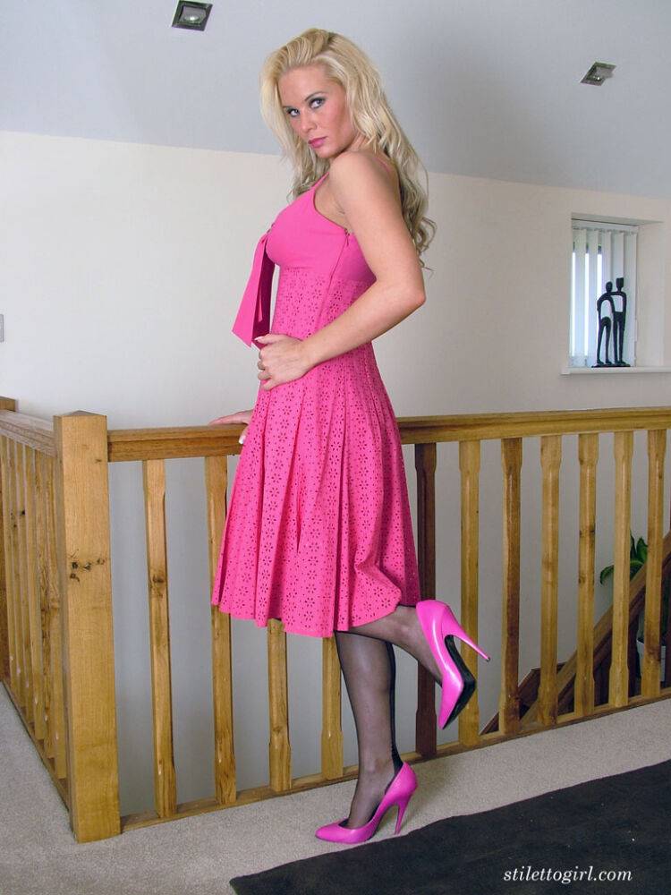 Blue eyed blonde models backseam nylons in pink pumps and a matching dress - #13