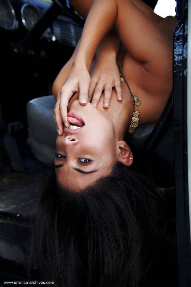 Sexy brunette Nadia models naked inside a vehicle while wearing suede boots - #10