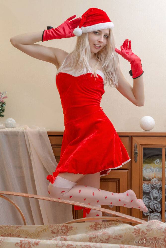 Thin blonde girl Egida models naked in Santa cap and sexy stockings - #10