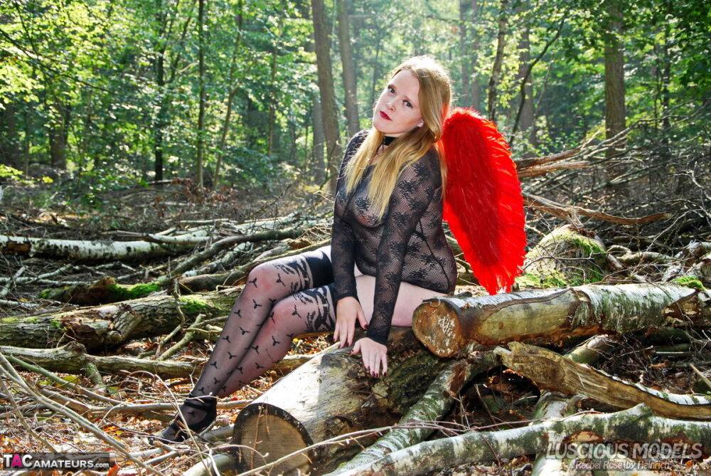 Amateur model poses in lingerie and stockings with angel wings in the woods - #16