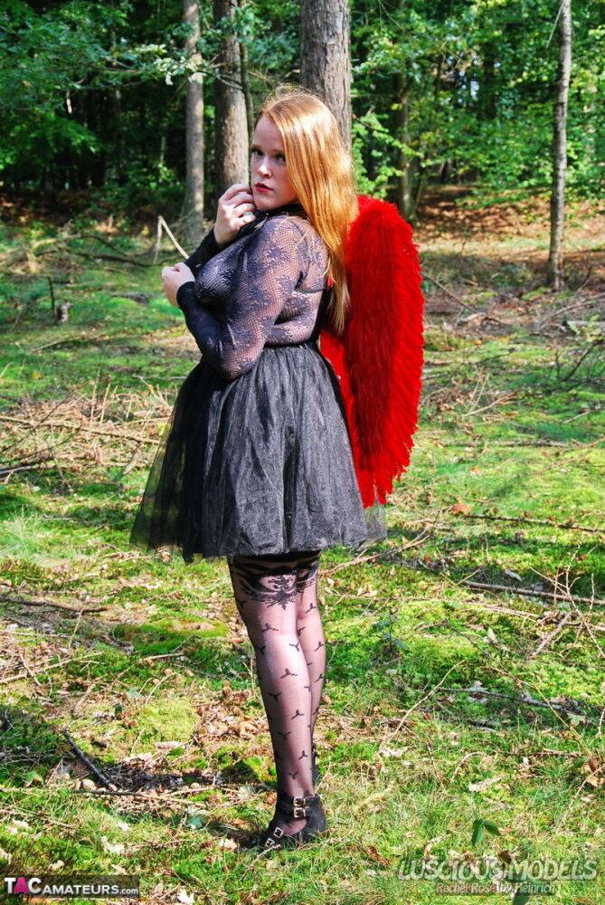 Amateur solo girl sports angel wings while modelling lingerie on a tree stump - #6