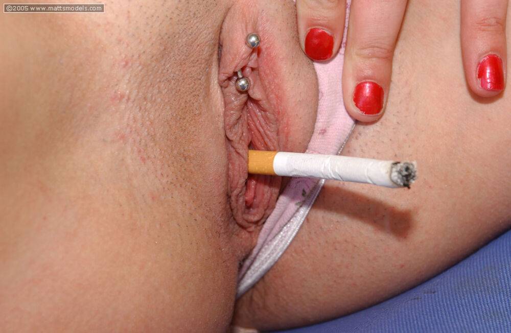 Amateur model smokes a cigarette while showing off her pierced vagina - #12