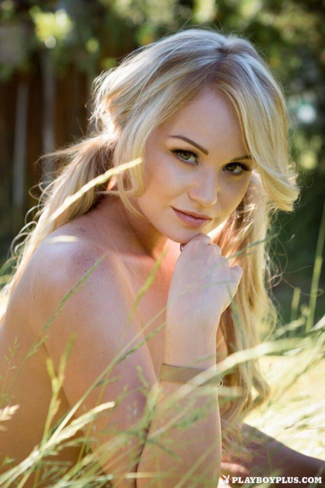 Cute blonde chick Elyse Jean models in the long grass for centerfold shoot - #6