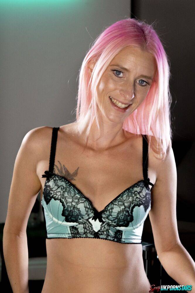 Caucasian female Roxy Lace models a bra and thong set while sporting dyed hair - #12