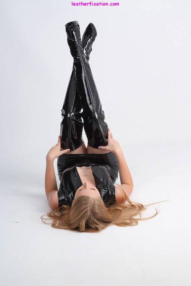 Blonde chick Hayley models non nude in a leather dress and thigh high boots - #11