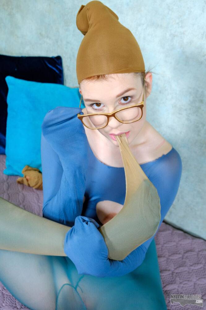 Nerdy redhead Kaira Love models in revealing hose with her glasses on - #14