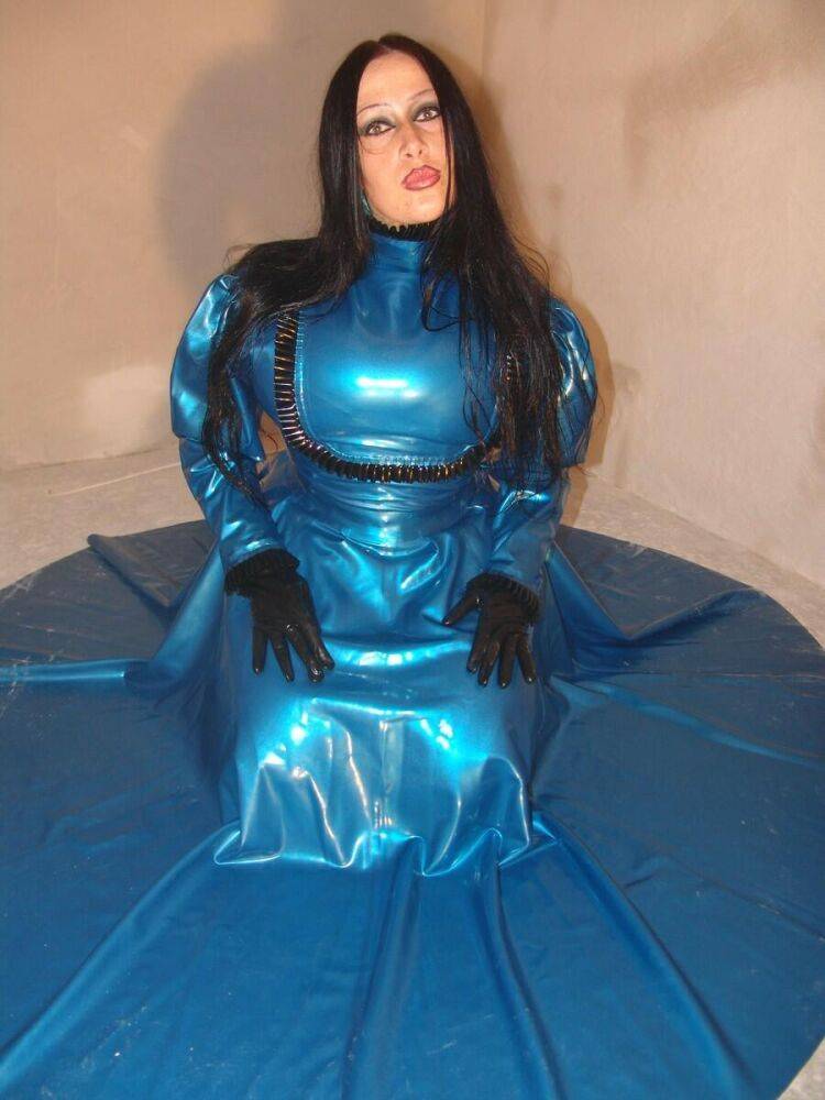 Dark-haired chick Lady Angelina models an amazing latex dress during a SFW gig - #10