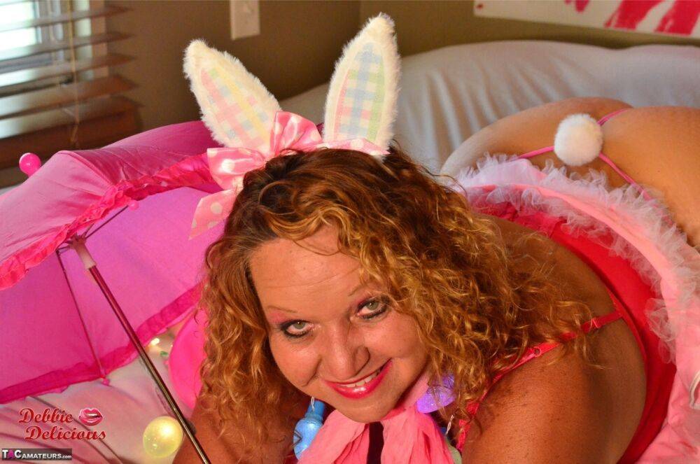 Mature plumper Debbie Delicious models on her bed in cosplay apparel - #11