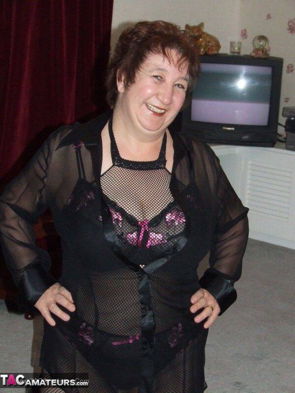 Mature BBW models by herself in crotchless pantyhose and leather boots - #14