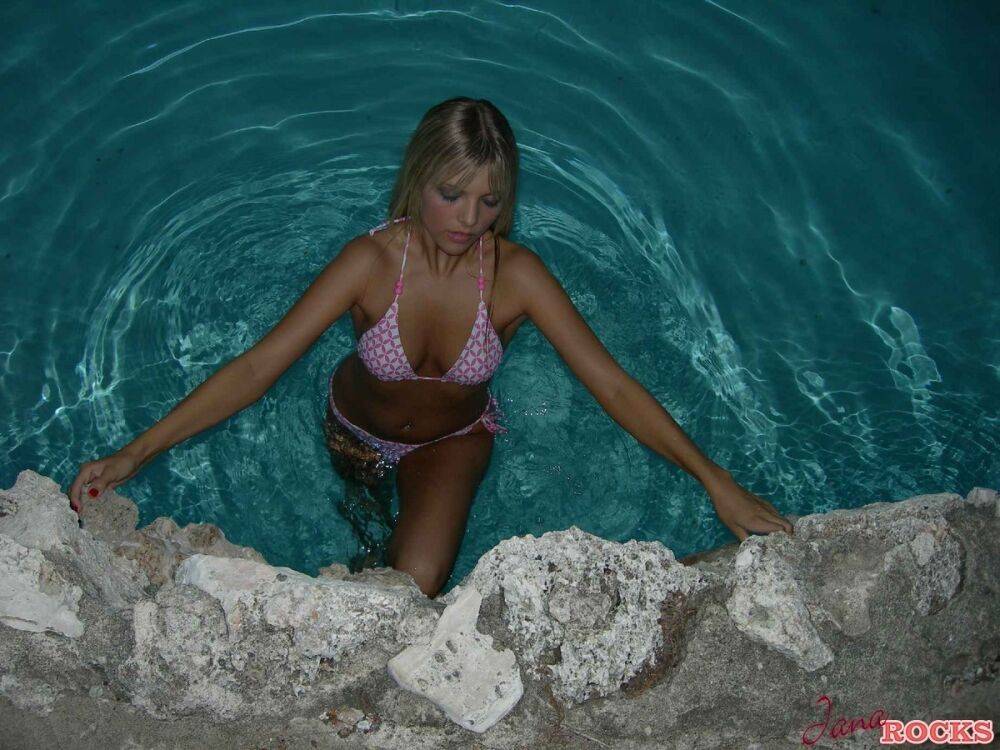 Blonde amateur Jana Jordan models a bikini while in an indoor swimming pool - #2
