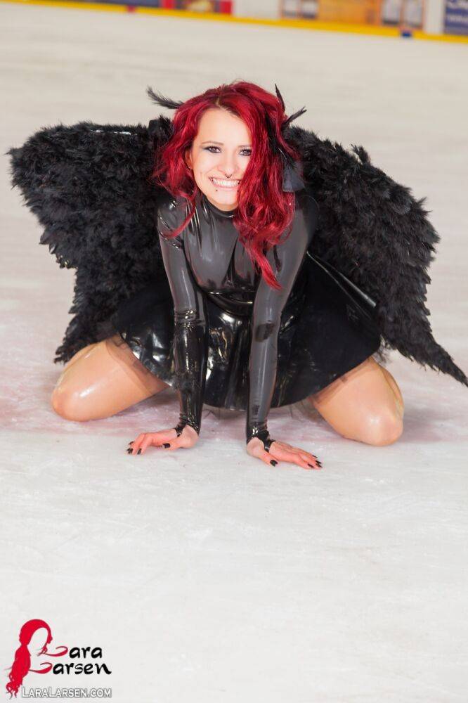 Redhead amateur Lara Larsen models non nude in latex attire with wings - #1