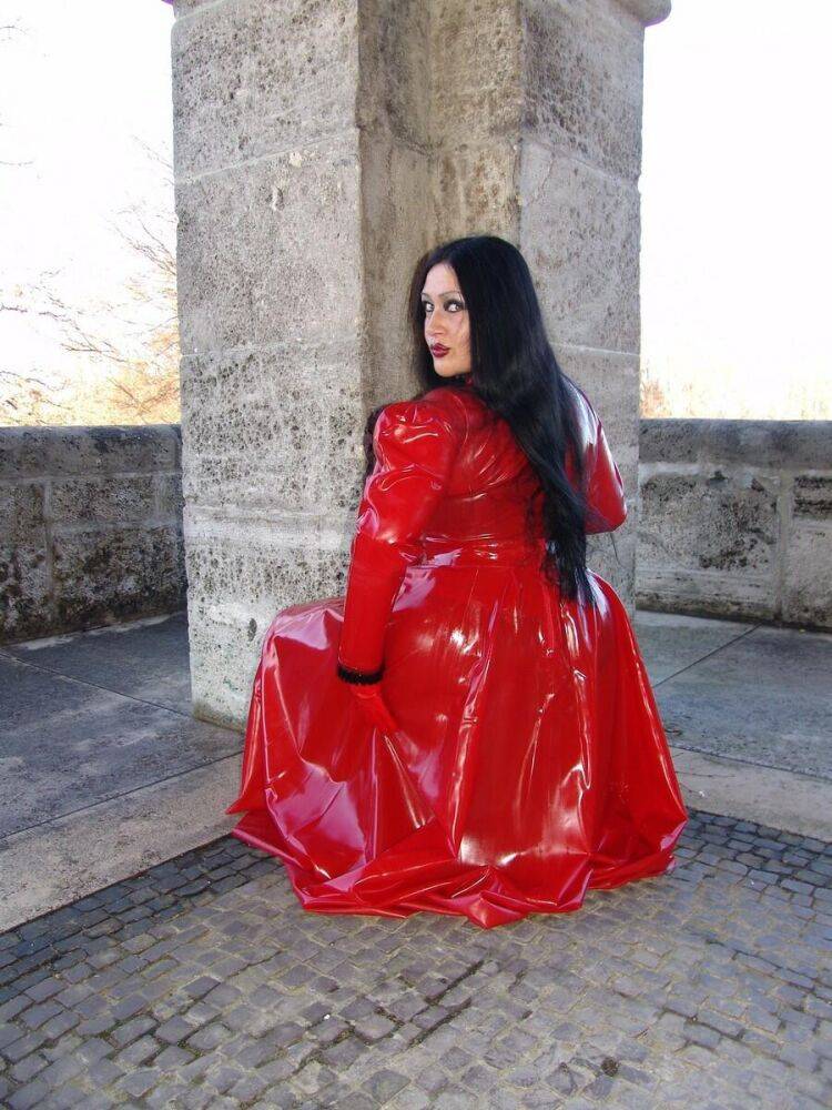 Goth woman Lady Angelina models a red latex dress during non-nude action - #10