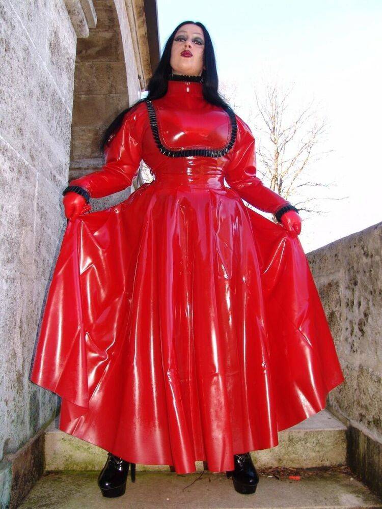 Goth woman Lady Angelina models a red latex dress during non-nude action - #12